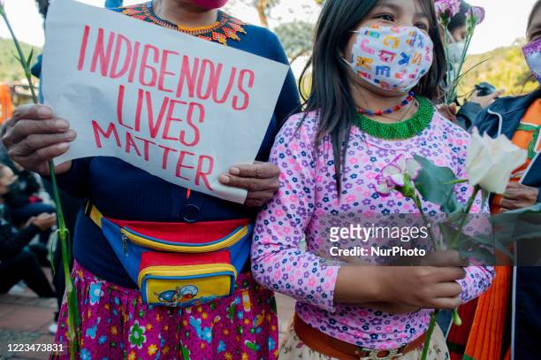 Indigenous women from the Embera communities in Colombia along with feminists gather in front of the military compound 'Canton Norte' to protest...