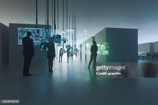 people standing against suspended computers - digital viewfinder stock pictures, royalty-free photos & images