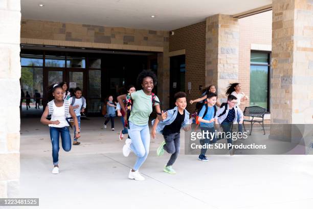 excited students on the last day of school - last day of school stock pictures, royalty-free photos & images