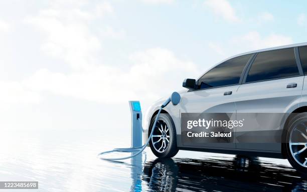 opladen van elektrische auto's - electric cars stockfoto's en -beelden