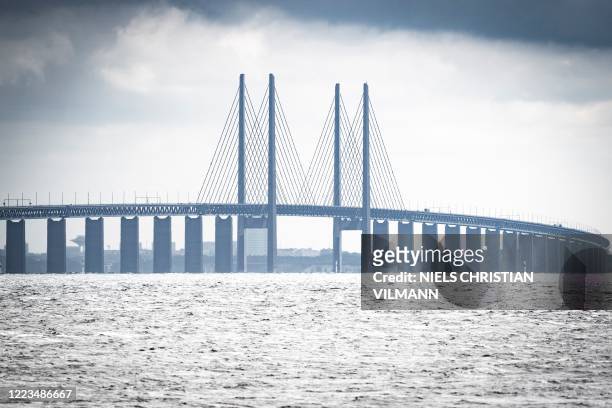 Picture taken on June 30, 2020 in Copenhagen, shows a view of the Oresund Bridge, which connects Denmark and Sweden . - The 20th anniversary of the...