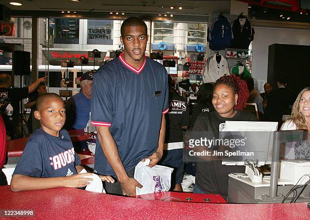 Derrick Favors and brother Brandon visit Champs Sports on June 24, 2010 in New York City.