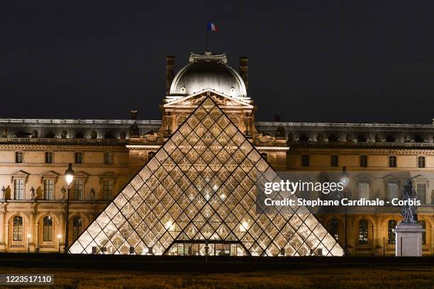 Super moon rises over the closed Louvre Museum and Louvre Pyramid as the lockdown continues due to the coronavirus outbreak on May 07, 2020 in Paris,...