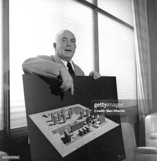 Spyros Skouras , President of 20th Century Fox film studios, with model of the studio lot, 1957.