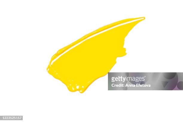 yellow smear of cosmetics - acrylmalerei stock-fotos und bilder