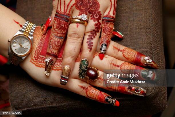 nail art and henna tattoos on young girl's hands. - henna hands stock-fotos und bilder