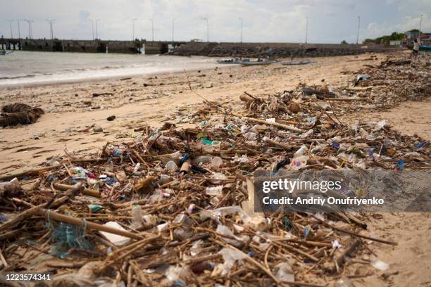 dirty beach - indonesia beach stock pictures, royalty-free photos & images