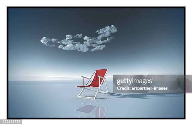 a red deck chair on a vast empty plain - sedia a sdraio foto e immagini stock