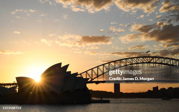 The iconic Sydney Opera House and Harbour Bridge at sunset on May 08, 2020 in Sydney, Australia. The operators of BridgeClimb Sydney remain hopeful...