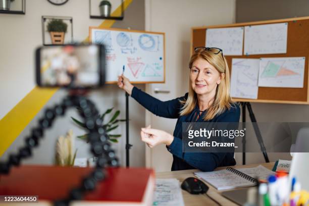 cheerful professor communicate with pupils over video call - learning stock pictures, royalty-free photos & images