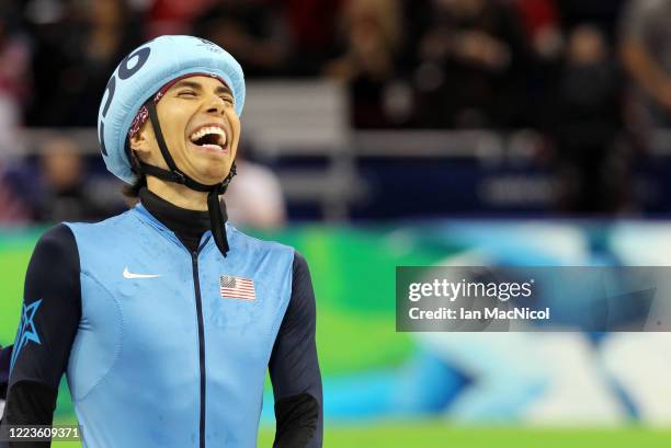 Disqualified Apolo Anton Ohno of the United States reacts after crossing the line behind gold medalist Charles Hamelin of Canada in the Men's 500m...