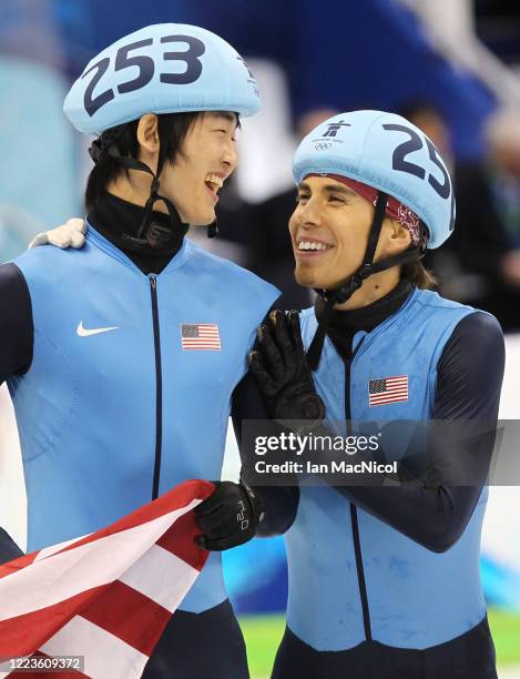Disqualified Apolo Anton Ohno of the United States reacts after crossing the line behind gold medalist Charles Hamelin of Canada in the Men's 500m...