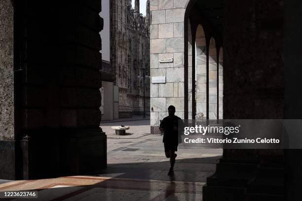 Runner in Piazza Duomo on May 08, 2020 in Milan, Italy. Italy was the first country to impose a nationwide lockdown to stem the transmission of the...