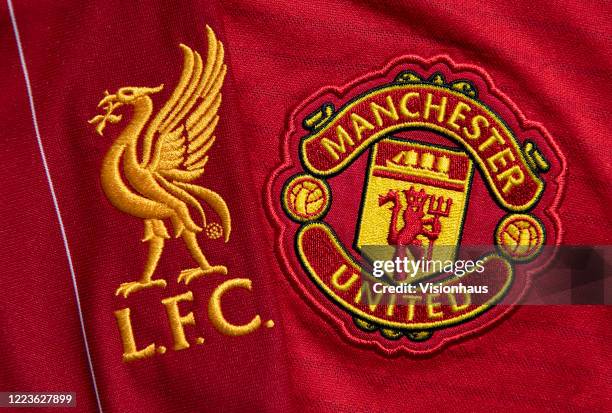 The Liverpool and Manchester United club crests on their first team home shirts on May 4, 2020 in Manchester, England