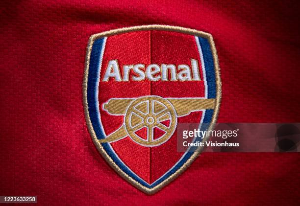 The Arsenal club crest on the first team home shirt displayed on May 6, 2020 in Manchester, England