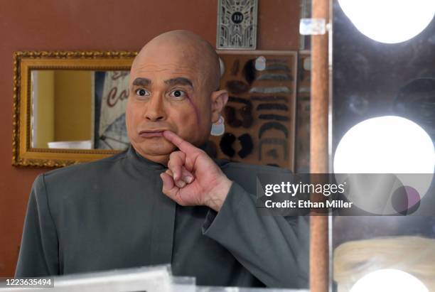 Actor, comedian and writer John Di Domenico is reflected in a mirror as he changes from U.S. President Donald Trump into the Dr. Evil character from...