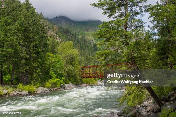 View of the bridge over the Wenatchee River near Leavenworth leading to the Old Pipeline Bed Trail in eastern Washington State, USA.