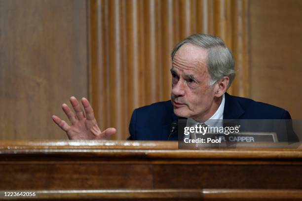 Sen. Thomas Carper asks a question of Internal Revenue Service Commissioner Charles Rettig at a hearing of the Senate Finance Committee on June 30,...