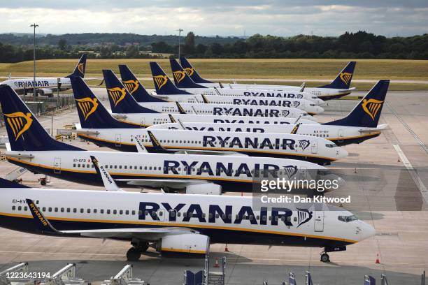 Ryanair planes are parked in a stand at Stansted Airport on June 30, 2020 in Stansted, United Kingdom. Passengers travelling between the UK and some...