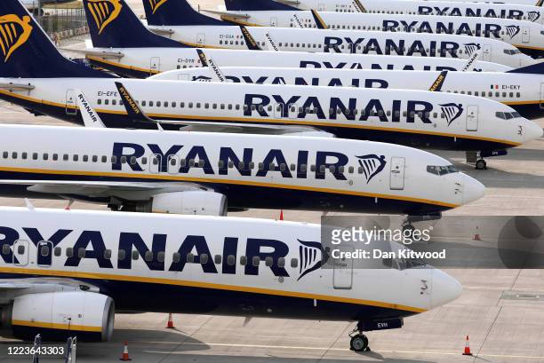 Ryanair planes are parked in a stand at Stansted Airport on June 30, 2020 in Stansted, United Kingdom. Passengers travelling between the UK and some...