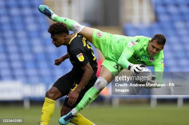 Reading's Rafael Cabral Barbosa claims the ball over Brentford's Ollie Watkins during the Sky Bet Championship match at the Madejski Stadium, Reading.