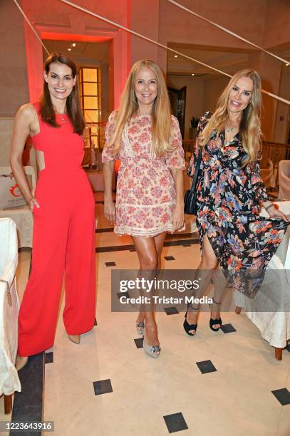 Rebecca Kunikowski, Jenny Elvers and Xenia Seeberg attend the Anja Gockel Fashion Show Sommer 2021 "ASUKA - Der Duft von morgen" at Hotel Adlon...