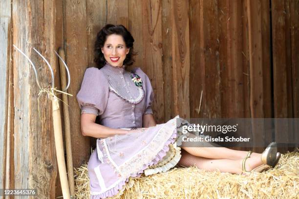 Dirndl fashion designer Lola Paltinger poses during a photo shooting to present her new Dirndl collection on June 25, 2020 at the Reit- und Zuchtfarm...