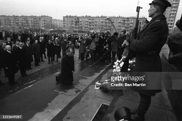 German Chancellor Willy Brandt kneels in front of the Monument to the Ghetto Heroes in a gesture of humility towards the victims of the Warsaw Ghetto...