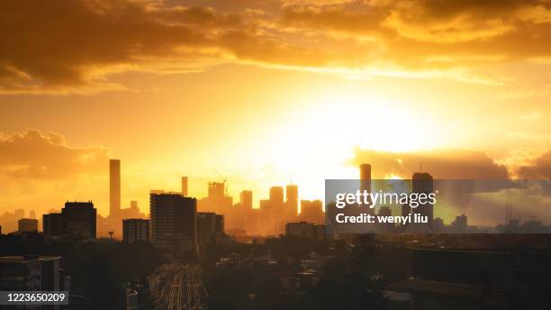 gorgeous sunrise above brisbane cbd viewing from the west suburb - queensland rail stock pictures, royalty-free photos & images