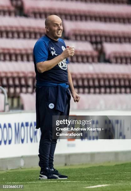 Wigan Athletic's manager Paul Cook enjoying a drink during the Sky Bet Championship match between Wigan Athletic and Stoke City at DW Stadium on June...