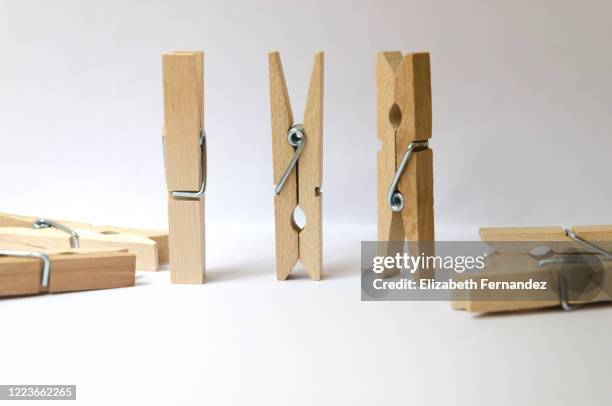 clothespins on white background - clothes peg isolated stock pictures, royalty-free photos & images