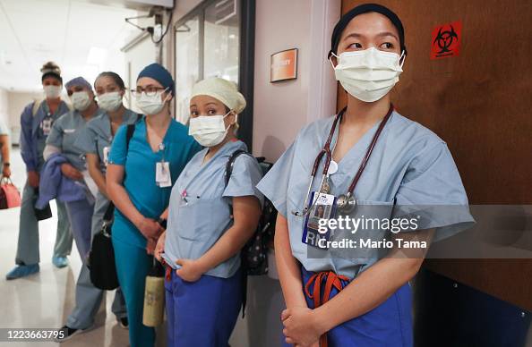 Shift Huddle Clinicians listen during a 'shift huddle' at shift change in the ...