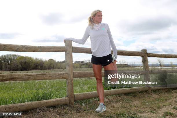 Olympic steeplechase athlete Emma Coburn stretches before her run during a training session on May 08, 2020 in Boulder, Colorado. Athletes across the...