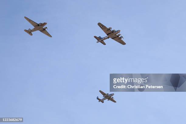 Flying Fortress" bomber, a B-25 Mitchell and a C-47 Skytrain perform a fly over in honor of the 75th anniversary of victory in Europe and the end of...