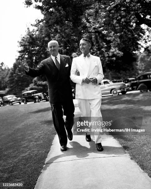 Former United States Postmaster General James A. Farley walks with United States Attorney General Thomas C. Clark during the Democratic National...