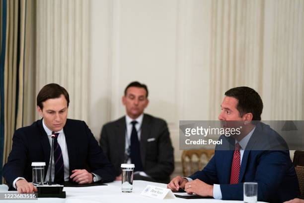 Senior advisor to President Donald Trump and his son-in-law Jared Kushner listens to Rep. Devin Nunes during a meeting with Republican members of...