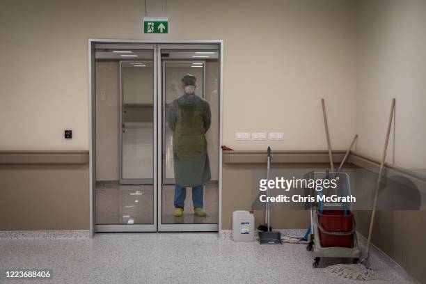 Medical worker watches on from outside a COVID-19 ICU unit at the Kartal Dr. Lutii Kirdar Education and Research Hospital, Intensive Care Unit on May...