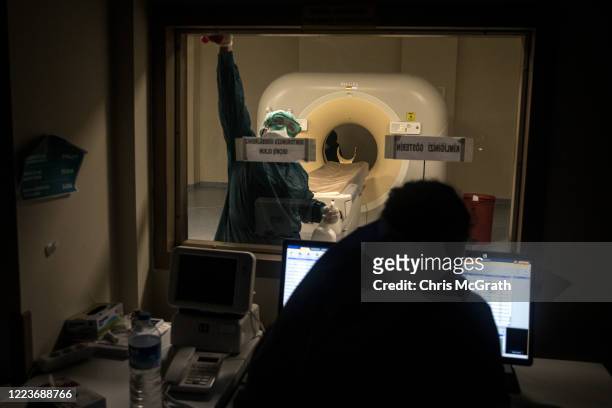 Medical worker cleans the inside of a Radiology room used to test suspected COVID-19 patients at the Kartal Dr. Lutii Kirdar Education and Research...