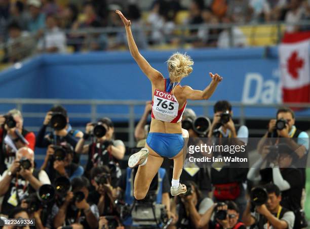 Darya Klishina of Russia competes in front of the cameras in the women's long jump final during day two of the 13th IAAF World Athletics...