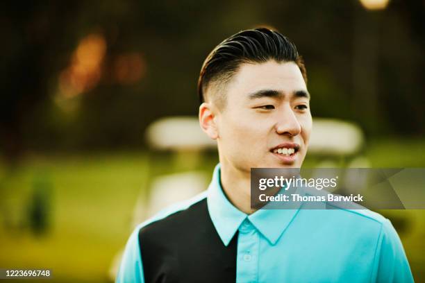 portrait of smiling man on golf course - professional golfer stock pictures, royalty-free photos & images