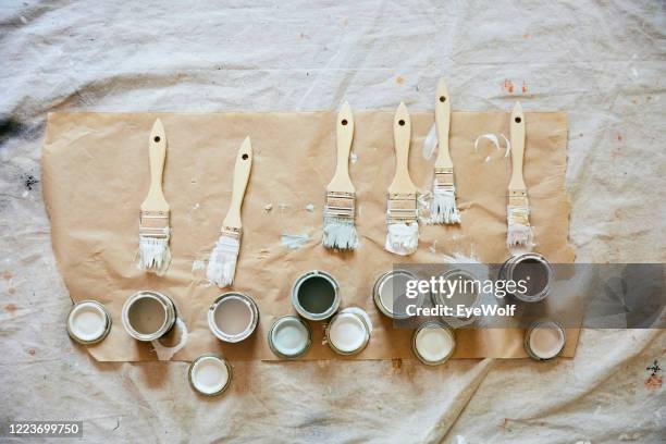 overhead shot of paint brushes and paint samples. - khaki tan stock-fotos und bilder