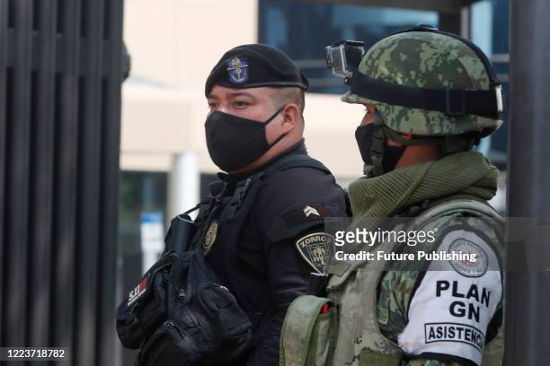 Military inspect vehicles as protocol security before drivers enter to Medica Sur Hospital, where Mexico City's chief of police, Omar Garcia Harfuch...