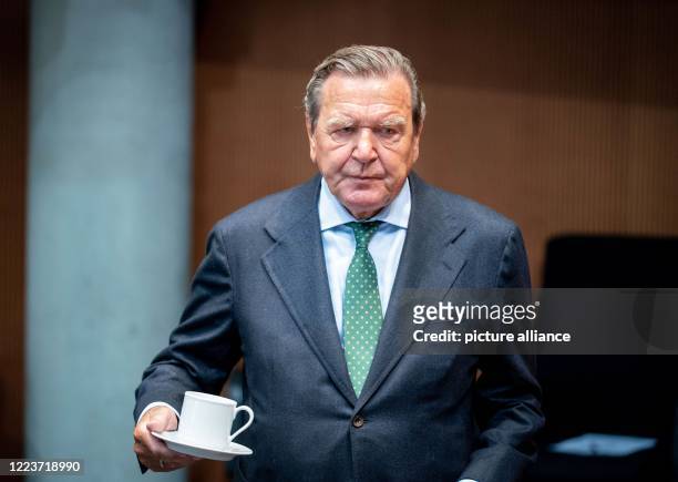 Gerhard Schröder , former German Chancellor and current Head of the Nord Stream 2 Administrative Board, waits for the start of the hearing in the...