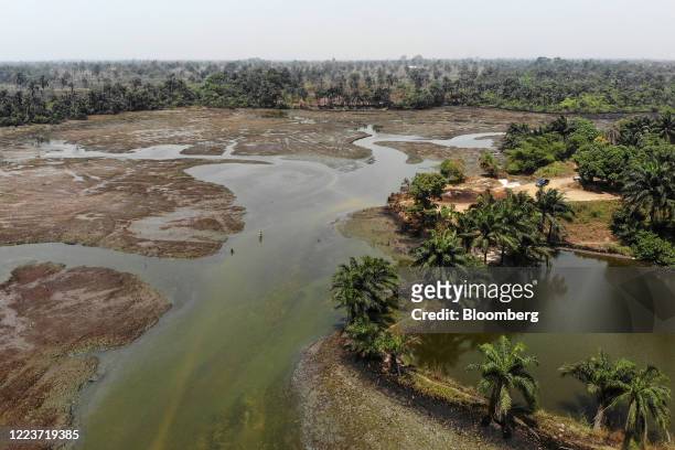 David Nkia, a fisherman, stands in crude oil polluted waters in this aerial photograph taken over Goi, Nigeria, on Friday, Jan. 31, 2020. Nigerians...