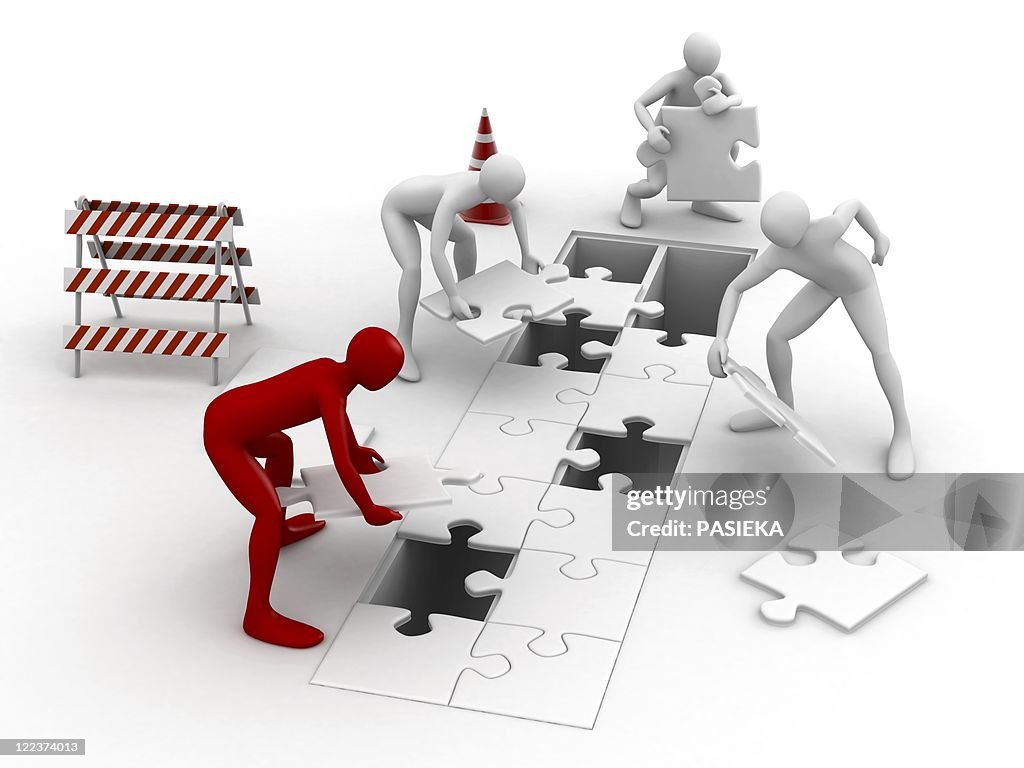 Men putting puzzle pieces together
