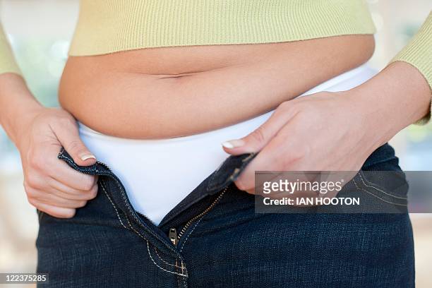 overweight woman - braune hose stock-fotos und bilder