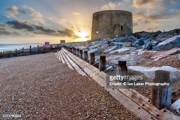 hythe, kent, england, united kingdom. 6 october 2006. hythe beach with groyne and martello towers. - hythe stock pictures, royalty-free photos & images