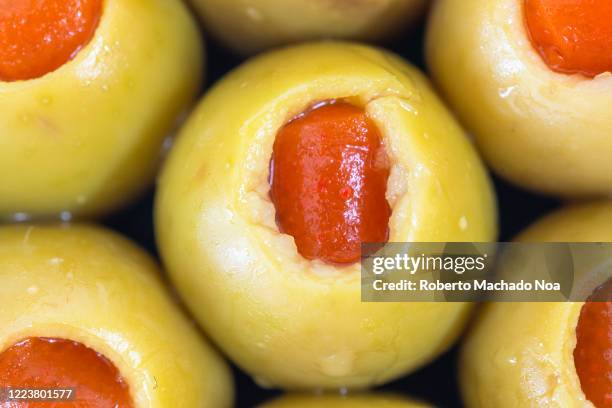 macro of stuffed green olive fruit, studio shot - stuffed olives stock pictures, royalty-free photos & images
