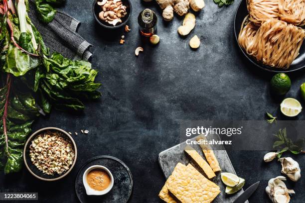 ingredients on a table for preparing a vegan dish - tempe stock pictures, royalty-free photos & images