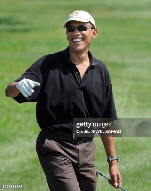 President Barack Obama walks after teeing off at the Farm Neck Golf Club in Oak Bluffs on Martha's Vineyard, Massachusetts, on August 24, 2009. The...